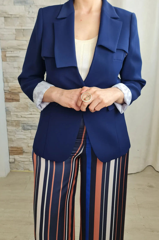 CALÇAS LARGAS ÀS RISCAS